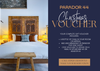 Advertisement for Parador 44 Christmas Voucher with a bedroom scene and contact information.